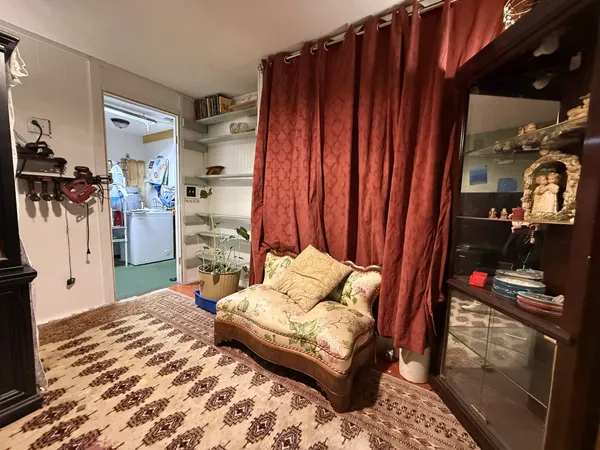 a view of room with a ceiling fan and wooden floor