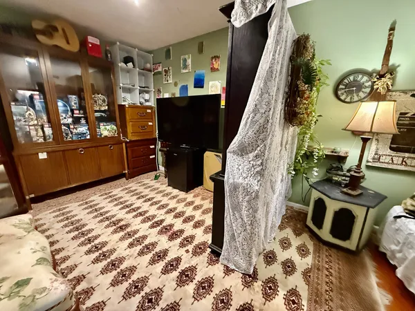 a room with furniture and a flat screen tv