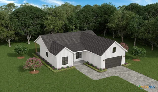 a aerial view of a white house in middle of the green field