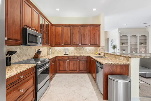 a dining table chair next to a window