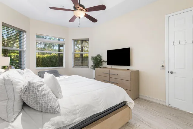 a bedroom with a bed and window