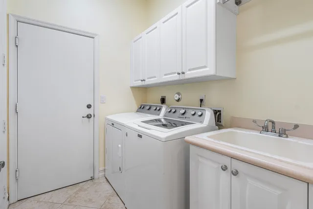 a view of a porch with chairs and backyard