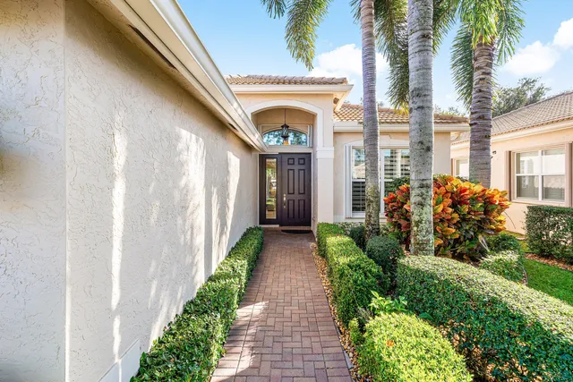 a view of a entrance to house with green space