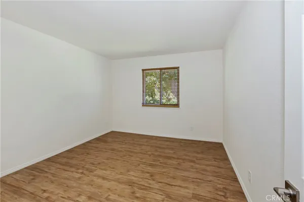 a spacious bathroom with a granite countertop tub sink and mirror