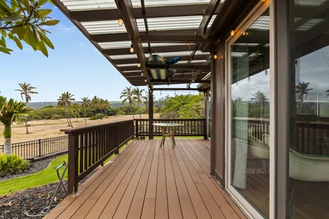 a view of balcony with wooden floor