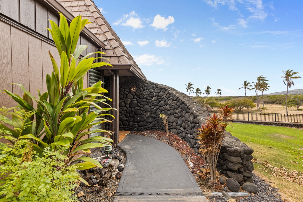 95-789 Ninole Loop Road, Unit 42 Naalehu, HI 96772 - Photo 16 of 30 a view of a yard with an outdoor space