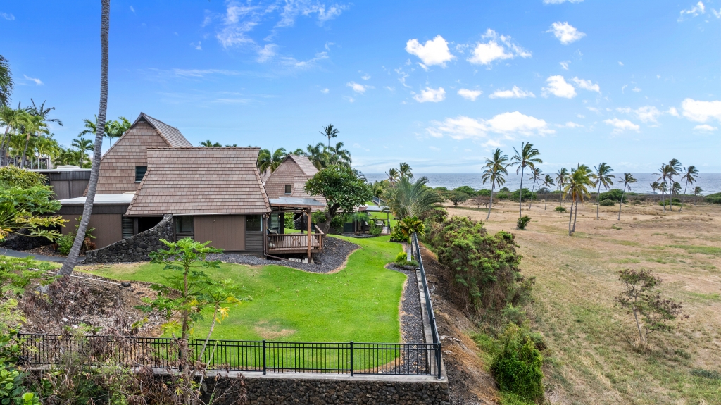 95-789 Ninole Loop Road, Unit 42 Naalehu, HI 96772 - Photo 18 of 30 a view of a house with yard and lake view