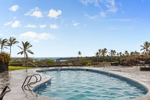 a view of swimming pool and outdoor seating