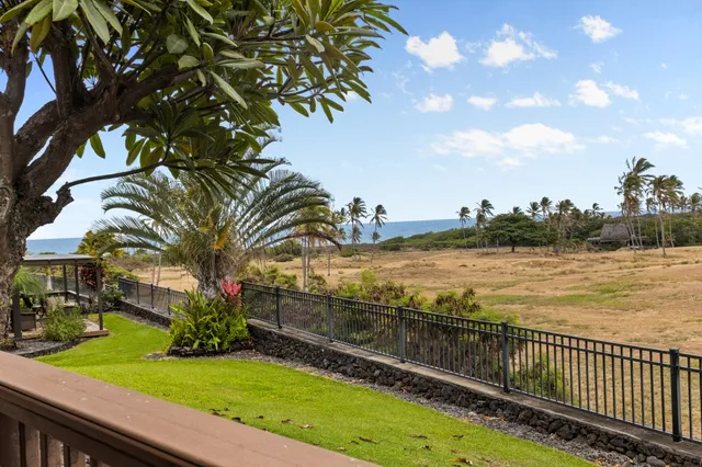 a view of a balcony with ocean view