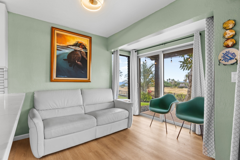 95-789 Ninole Loop Road, Unit 42 Naalehu, HI 96772 - Photo 8 of 30 a living room with furniture and a window