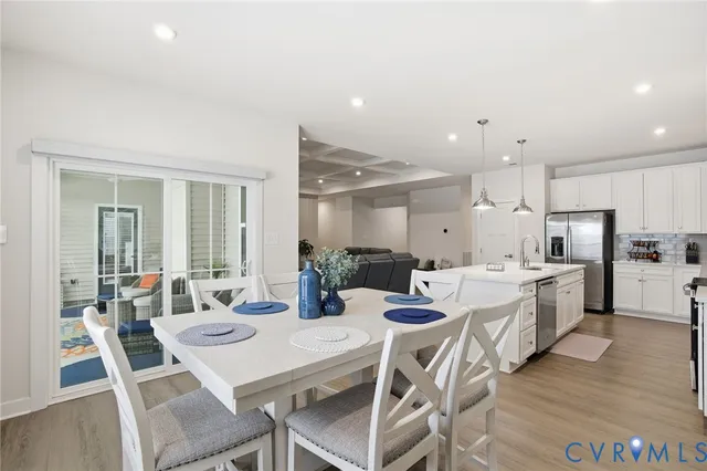 a large kitchen with a table and chairs