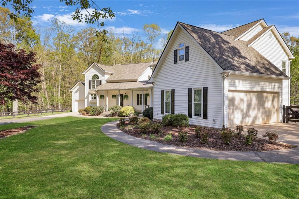 2203 Arbor Hill Road Canton, GA 30115 - Photo 11 of 65 a front view of house with a garden and patio