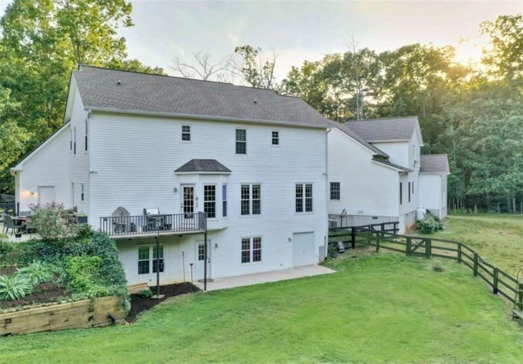 2203 Arbor Hill Road Canton, GA 30115 - Photo 12 of 65 a aerial view of a house next to a big yard