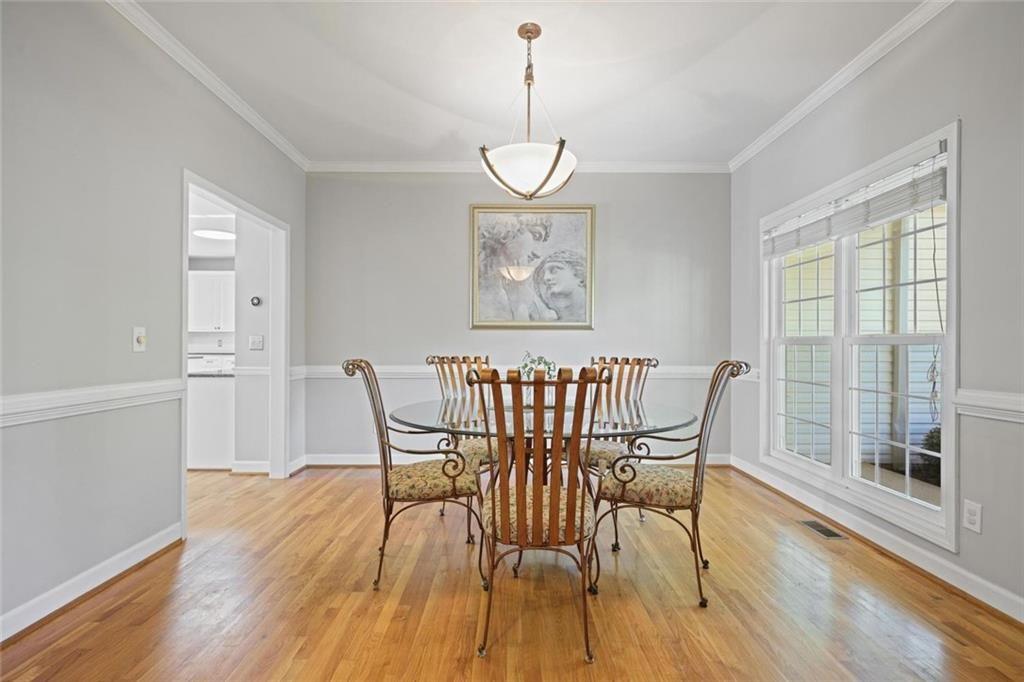 2203 Arbor Hill Road Canton, GA 30115 - Photo 28 of 65 a view of a dining room with furniture window and wooden floor