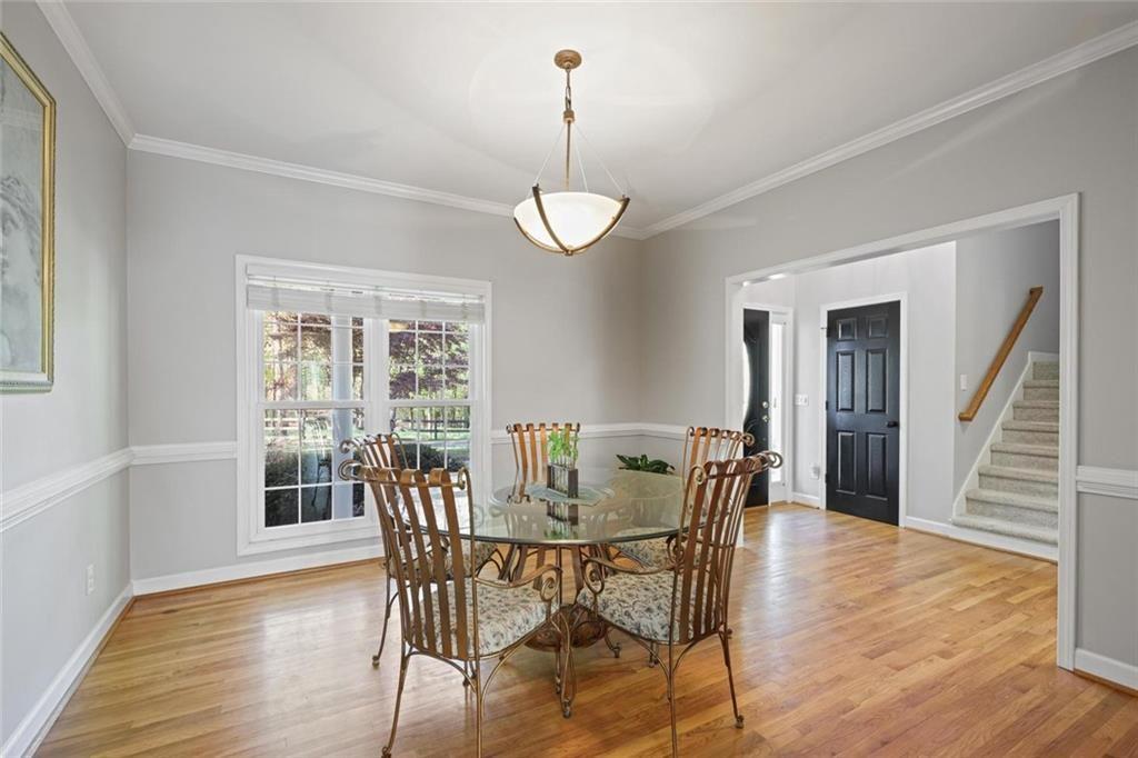 2203 Arbor Hill Road Canton, GA 30115 - Photo 39 of 65 a view of a dining room with furniture window and wooden floor