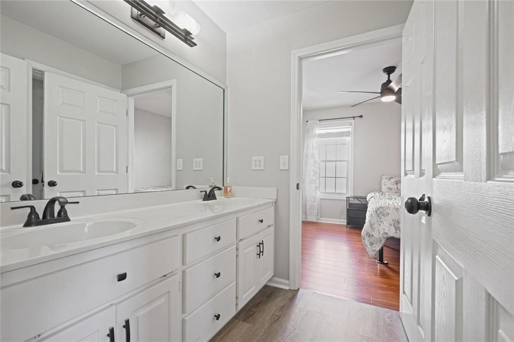 2203 Arbor Hill Road Canton, GA 30115 - Photo 47 of 65 a bathroom with a double vanity sink and mirror with shower