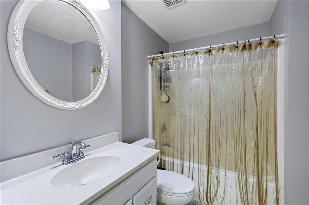 2203 Arbor Hill Road Canton, GA 30115 - Photo 54 of 65 a bathroom with a sink a toilet and shower
