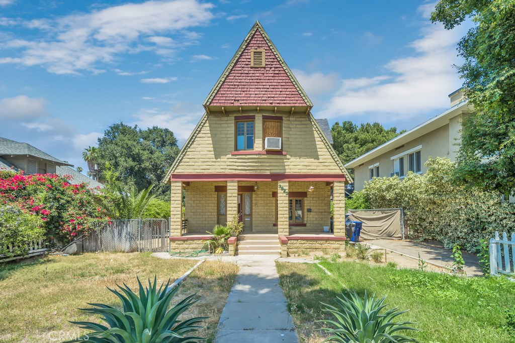 3923 5th Street Riverside, CA 92501 - Photo 1 of 1 front view of a house with a yard