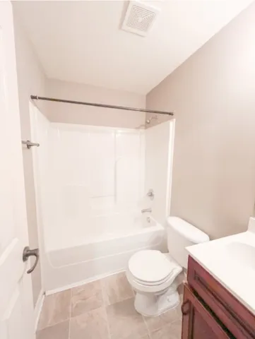 a bathroom with a toilet a sink and a bathtub