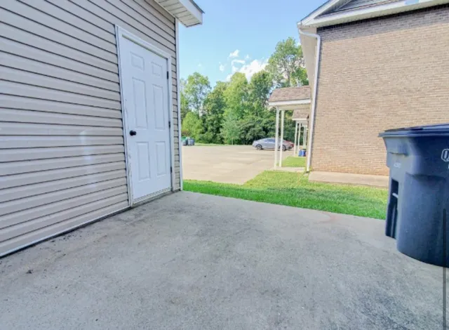 a view of a house with a yard and garage