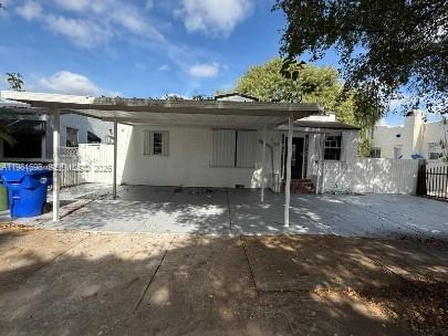 a view of a house with a yard and garage