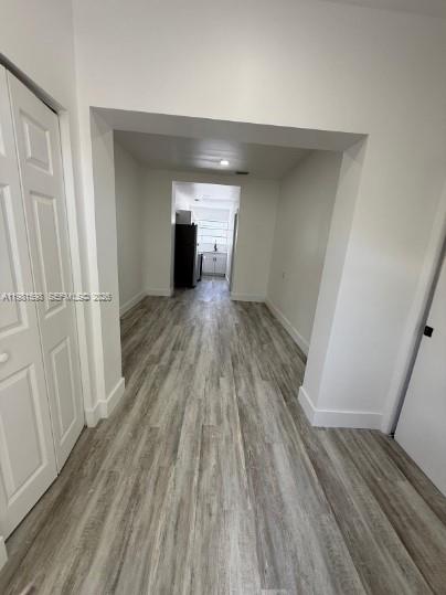 913 Northwest 46th Street, Unit 2 Miami, FL 33127 - Photo 2 of 7 a view of empty room with wooden floor