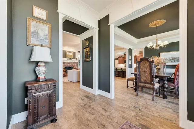 a living room with fireplace furniture and a wooden floor