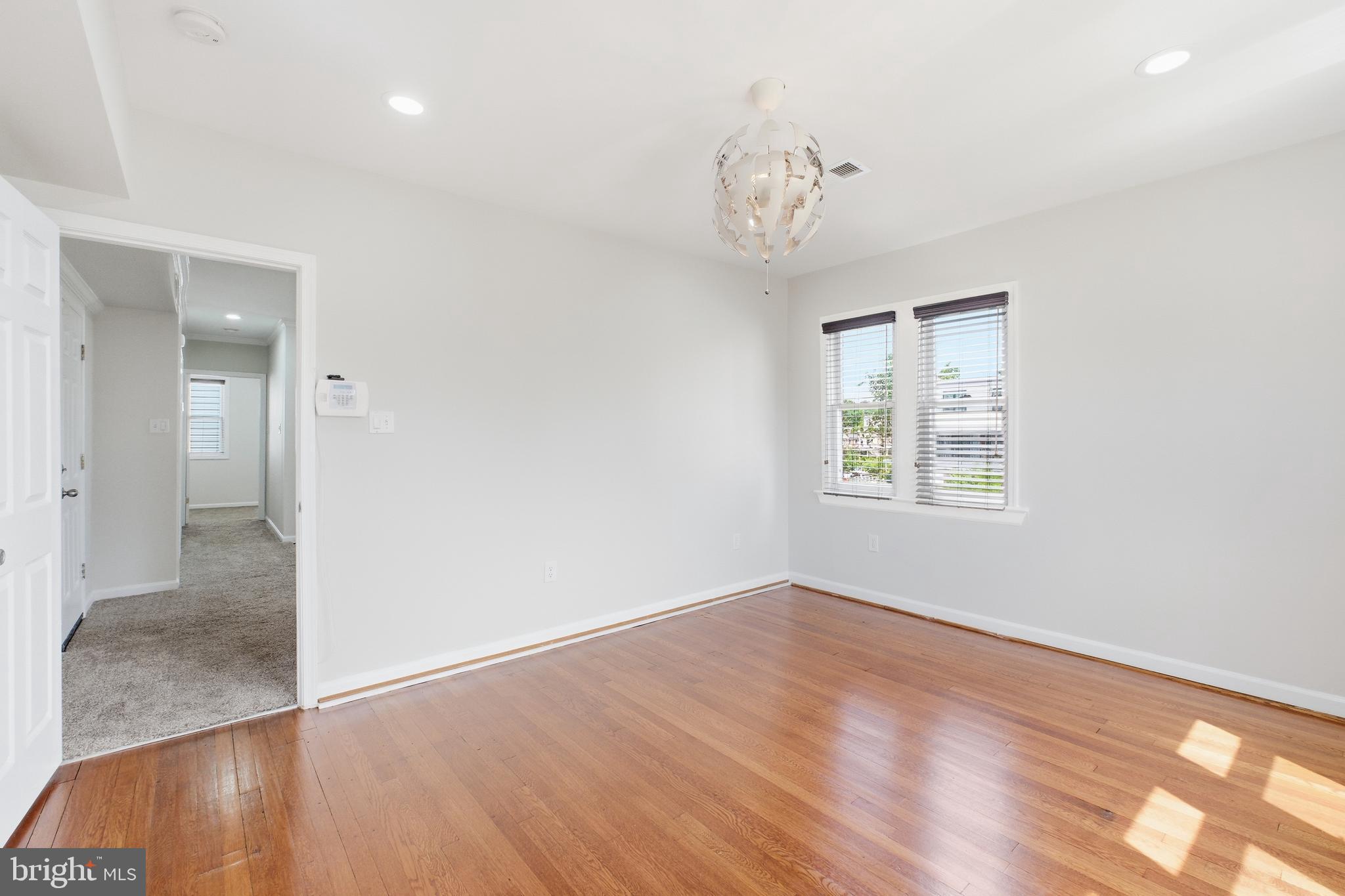 2712 6th Street Northeast Washington, DC 20017 - Photo 17 of 24 an empty room with wooden floor and windows