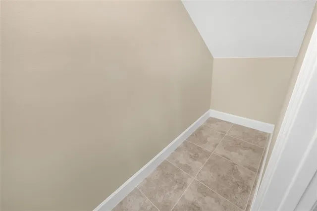 a bathroom with a granite countertop sink a large mirror and a shower