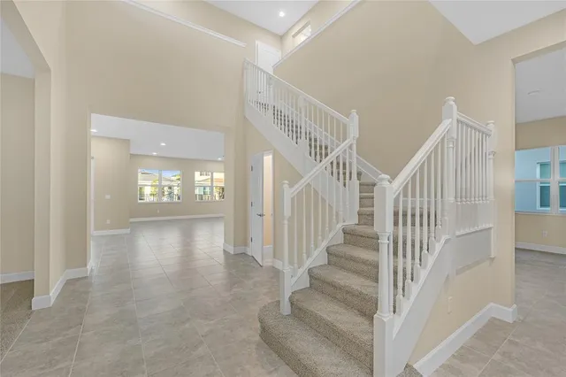 a bathroom with a granite countertop sink a mirror and a shower