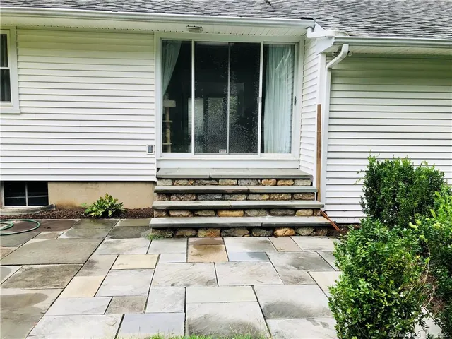 a view of a backyard with potted plants