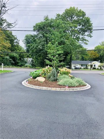 a view of a backyard with swimming pool