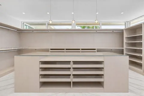 an aerial view of a house with yard swimming pool and outdoor seating