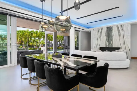a large kitchen with stainless steel appliances granite countertop a lot of counter space and a large window