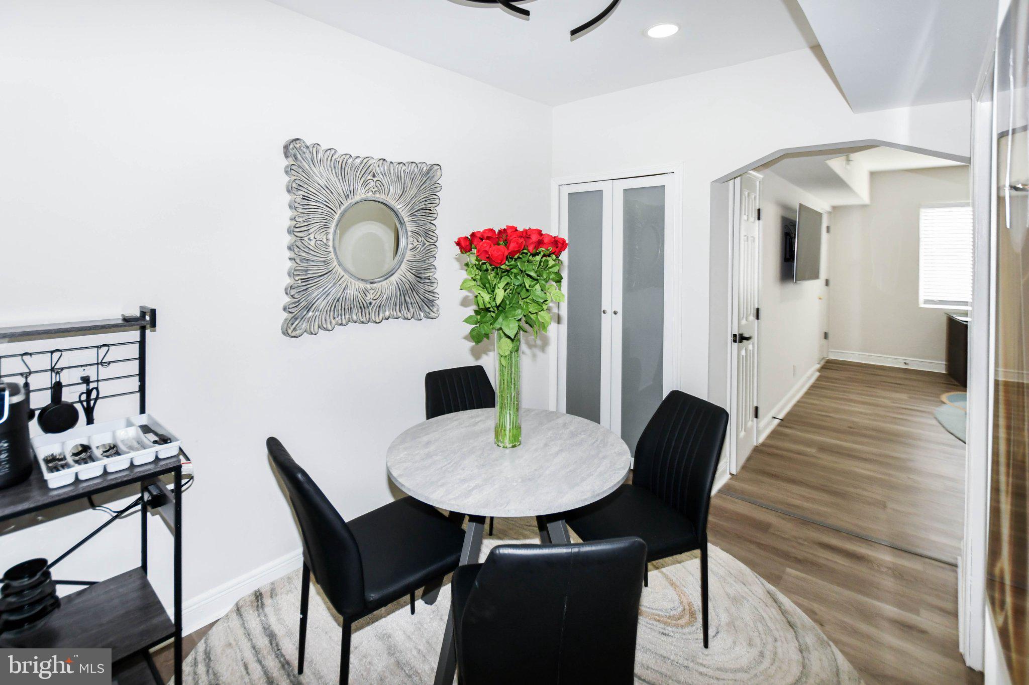 554 Newcomb Street Southeast, Unit 4 Washington, DC 20032 - Photo 11 of 20 Chic dining nook with vibrant blooms.