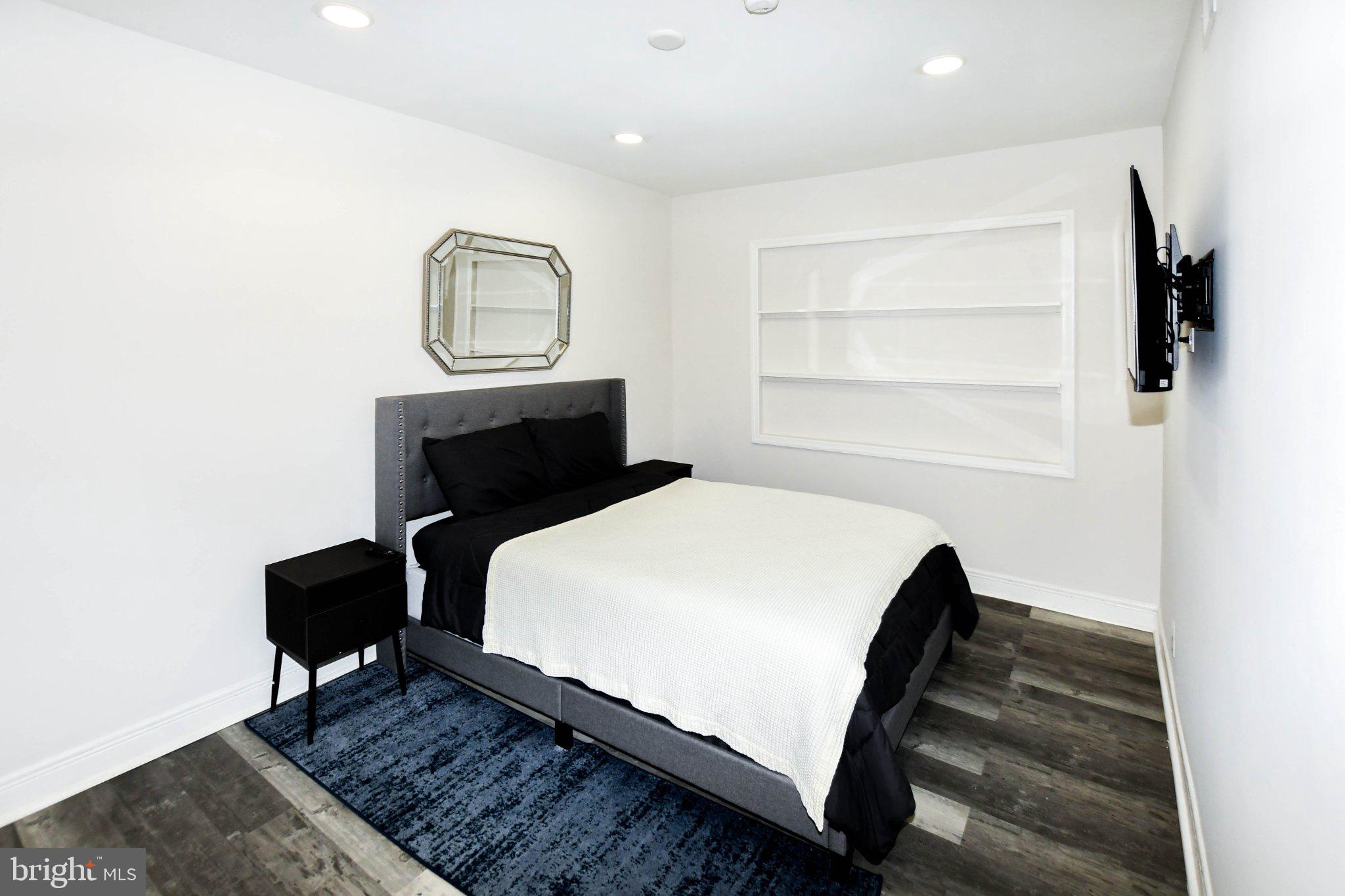 554 Newcomb Street Southeast, Unit 4 Washington, DC 20032 - Photo 12 of 20 Modern serenity in a cozy bedroom.