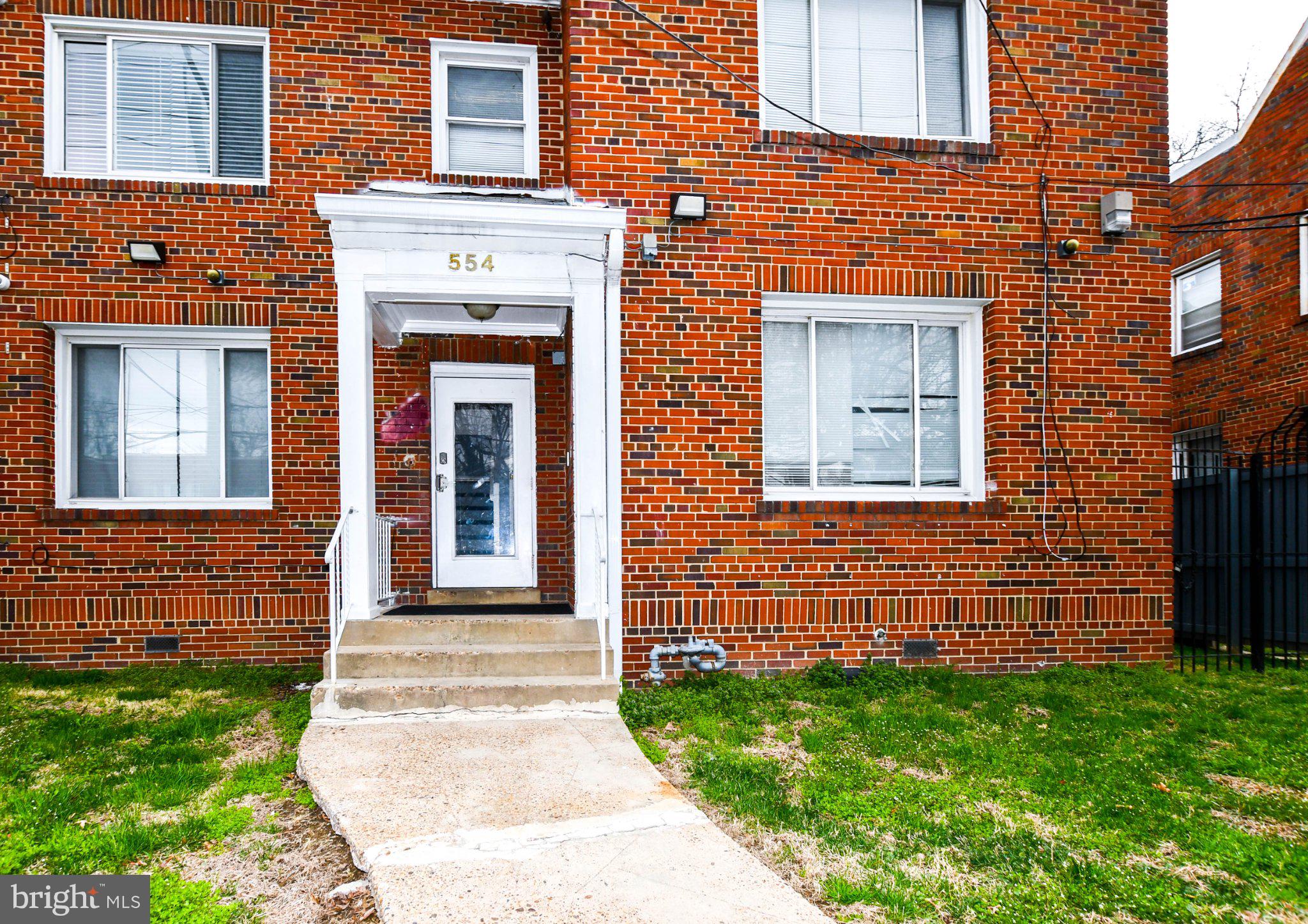 554 Newcomb Street Southeast, Unit 4 Washington, DC 20032 - Photo 2 of 20 Charming brick facade with welcoming entry.
