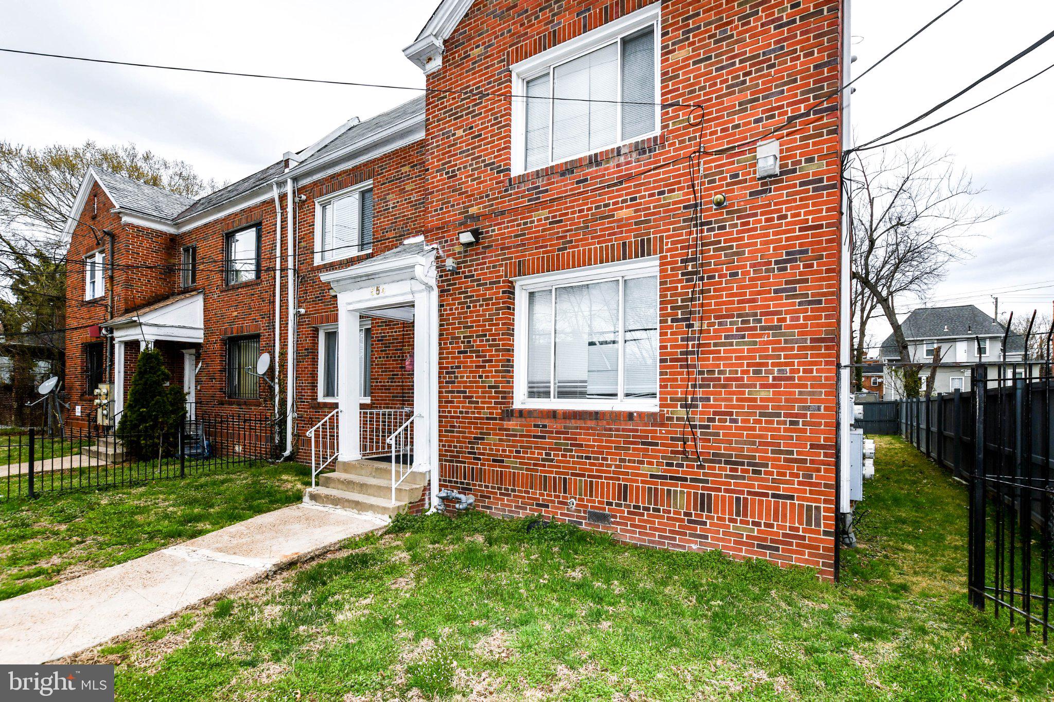 554 Newcomb Street Southeast, Unit 4 Washington, DC 20032 - Photo 3 of 20 Charming brick duplex with inviting entry.