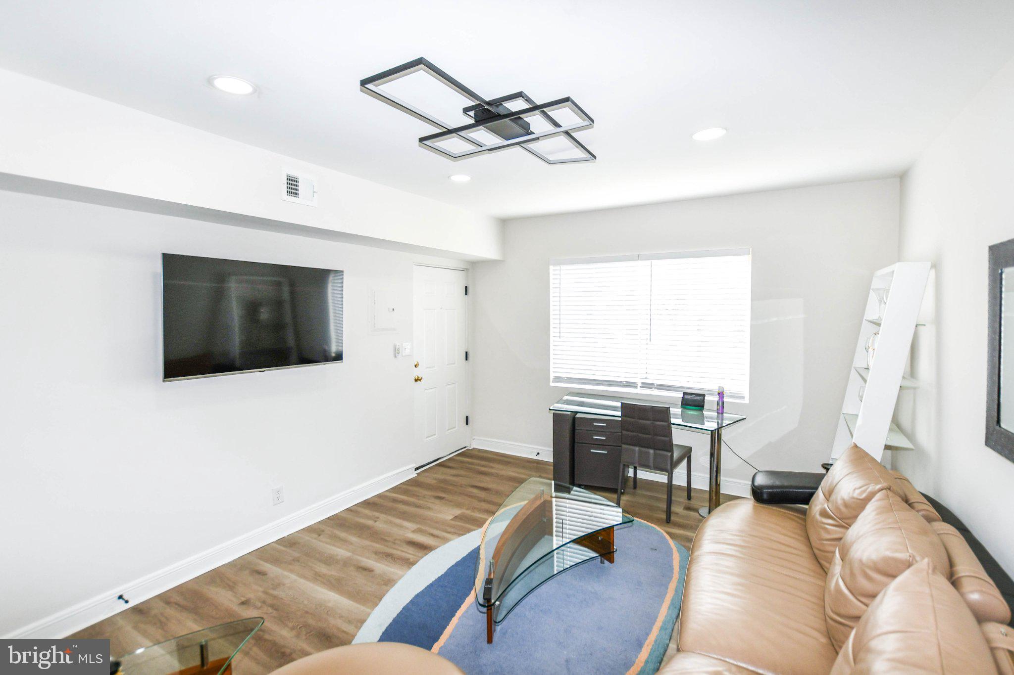554 Newcomb Street Southeast, Unit 4 Washington, DC 20032 - Photo 6 of 20 Modern living space with natural light.