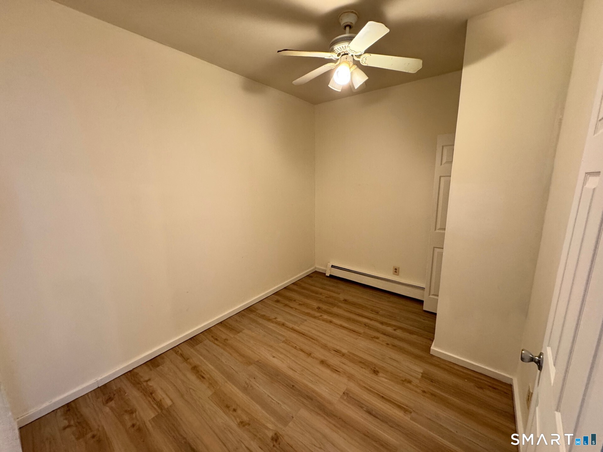 1 Seeley Street, Unit 2 Bridgeport, CT 06605 - Photo 6 of 8 wooden floor in an empty room