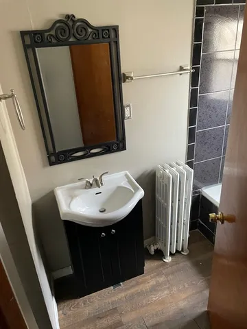 a bathroom with a sink and mirror