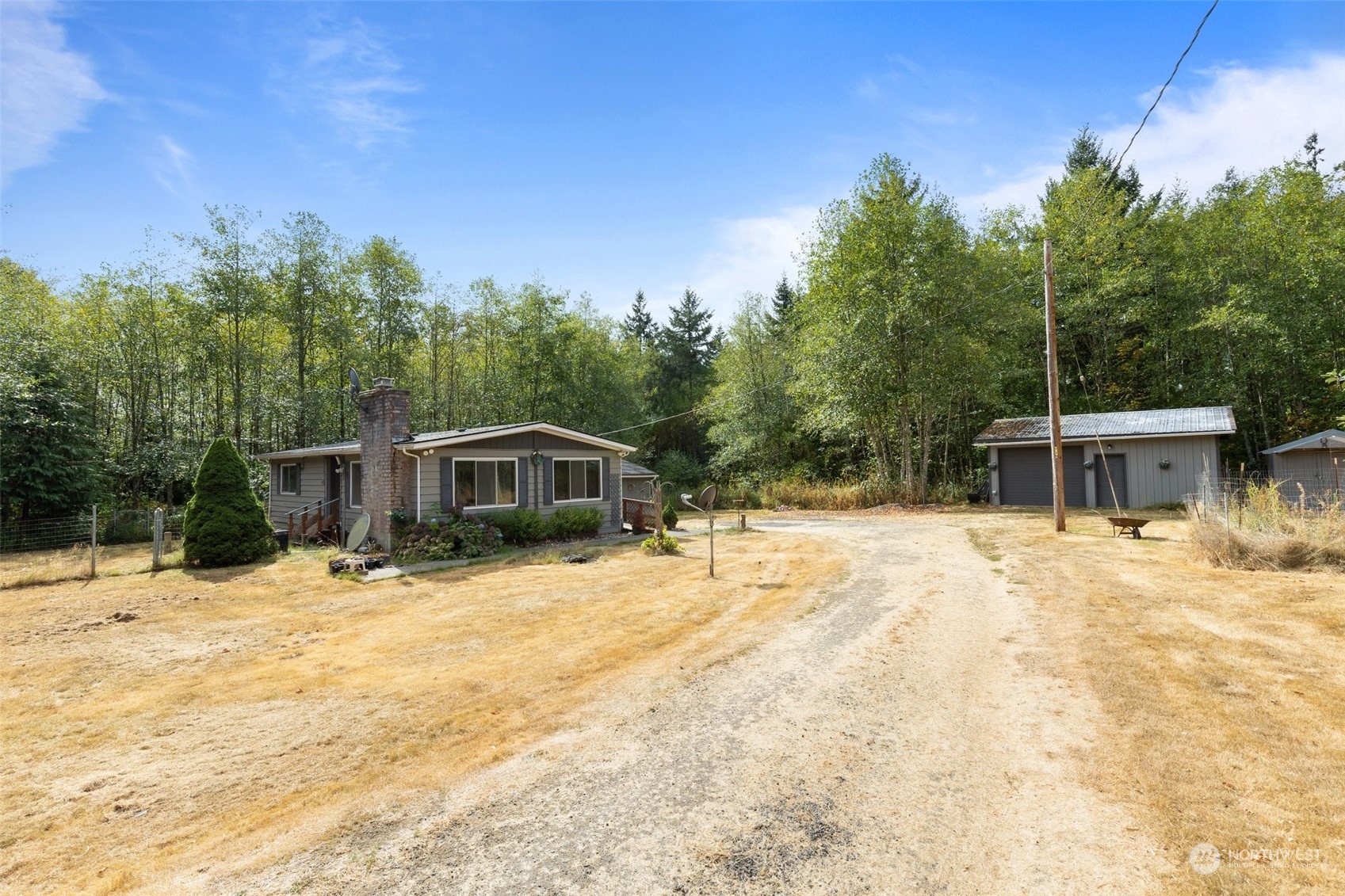 1001 Logan Hill Road Chehalis, WA 98532 - Photo 1 of 23 a tall yellow house with a yard in front of it