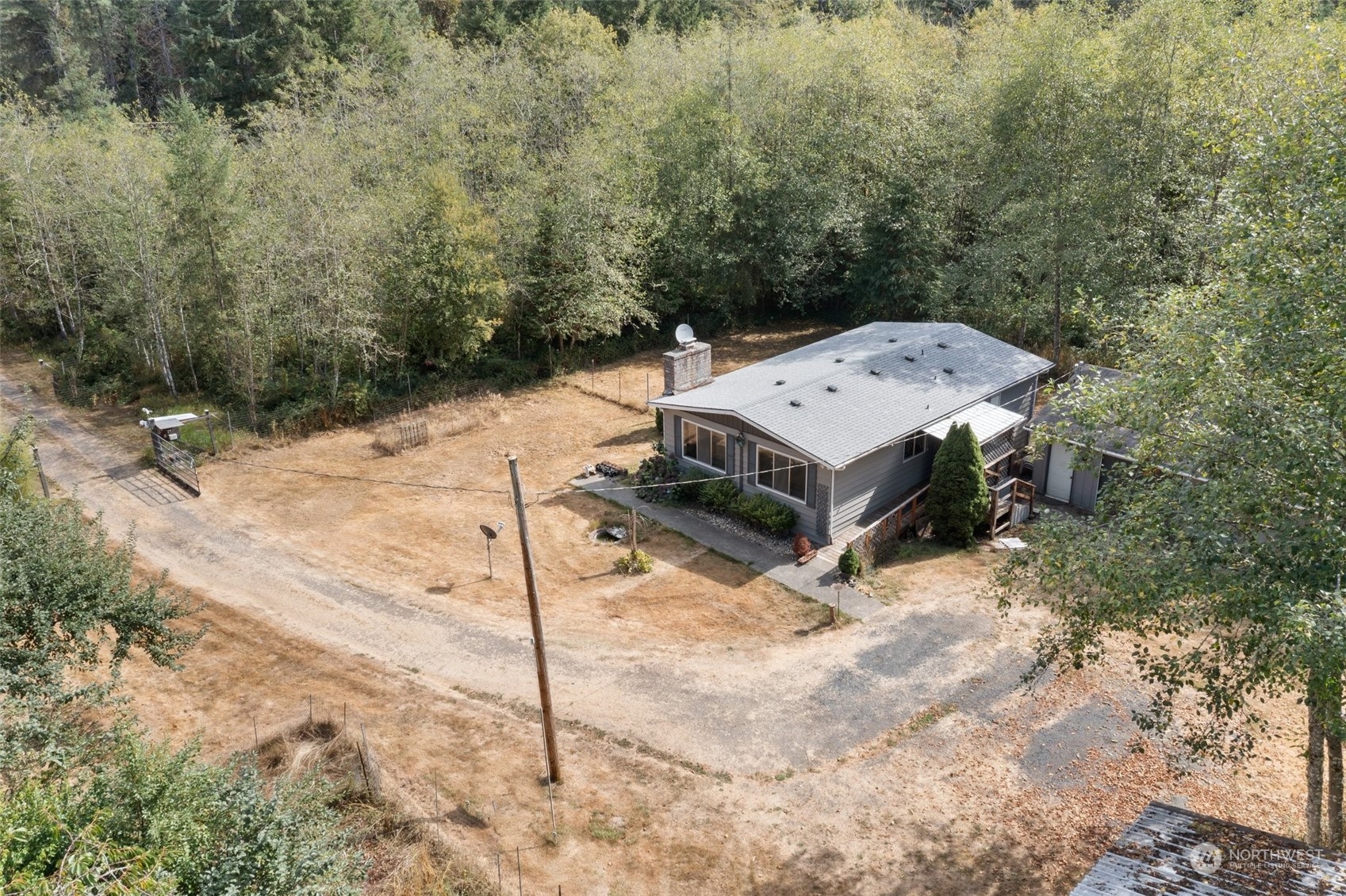 1001 Logan Hill Road Chehalis, WA 98532 - Photo 22 of 23 a view of a backyard with a barn and mountain view
