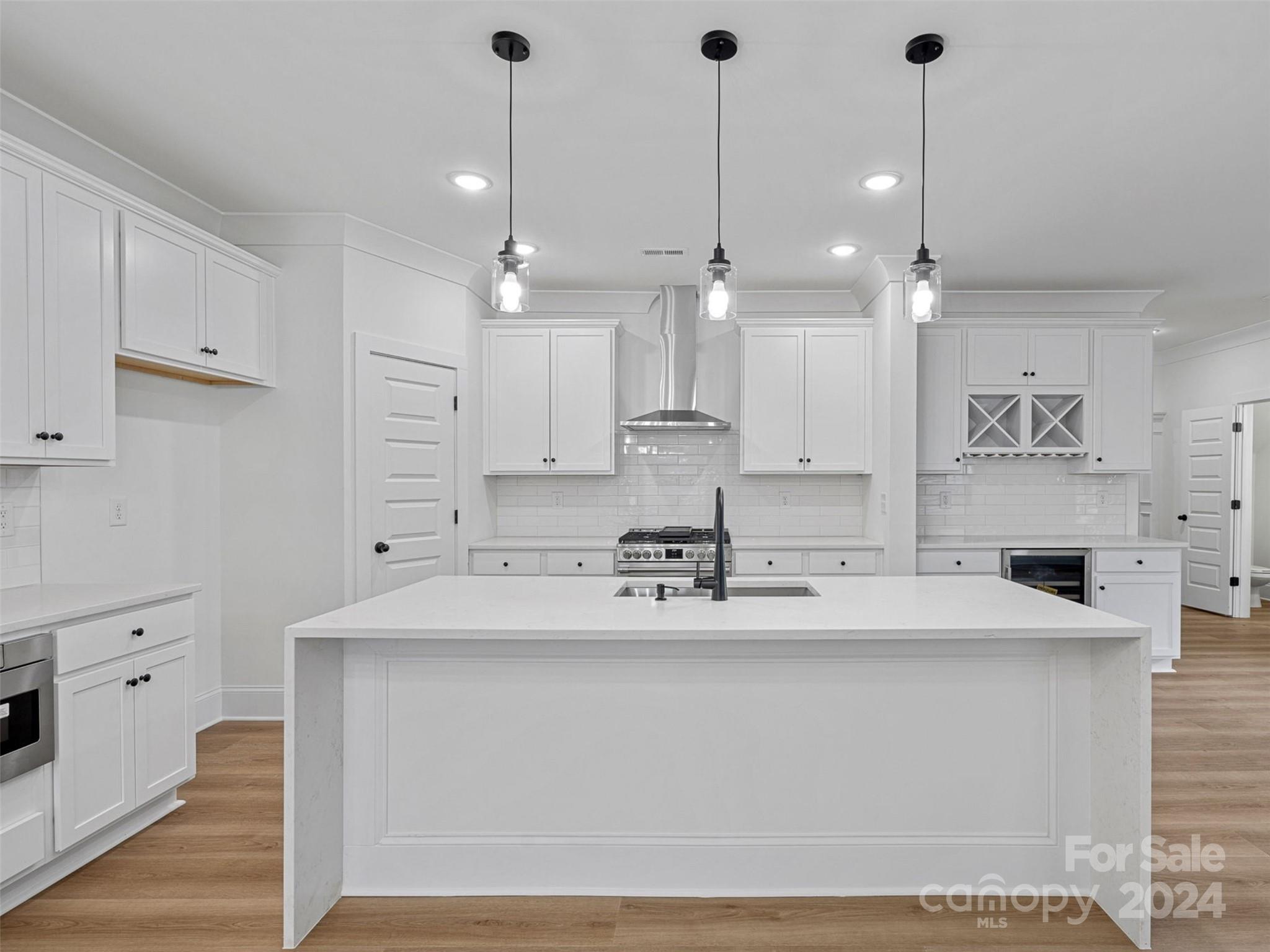 5507 Fairview Road Charlotte, NC 28209 - Photo 5 of 29 a kitchen with kitchen island a sink stainless steel appliances and cabinets