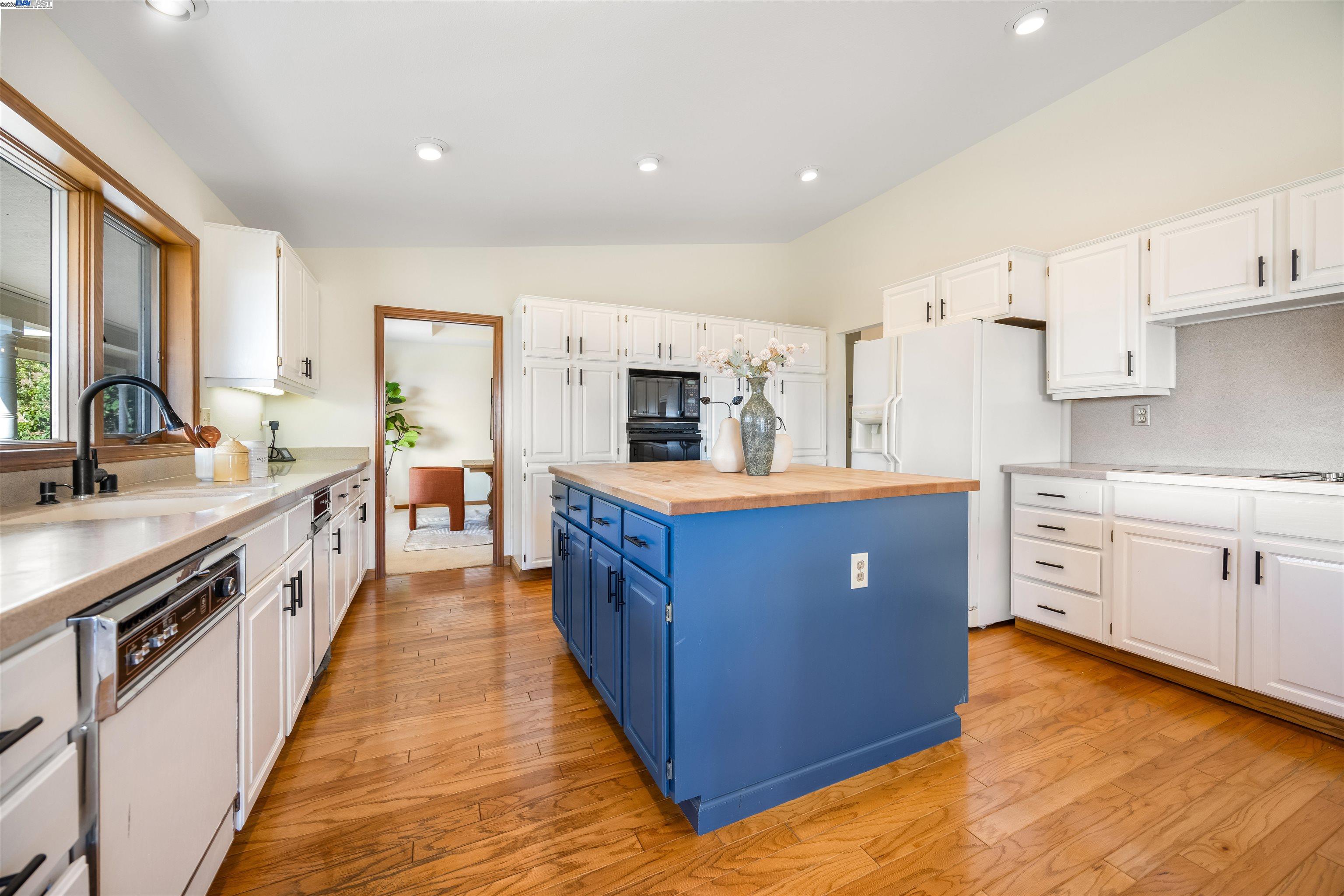 9050 Highland Road Livermore, CA 94551 - Photo 11 of 57 a large kitchen with stainless steel appliances kitchen island granite countertop a large counter top and a stove