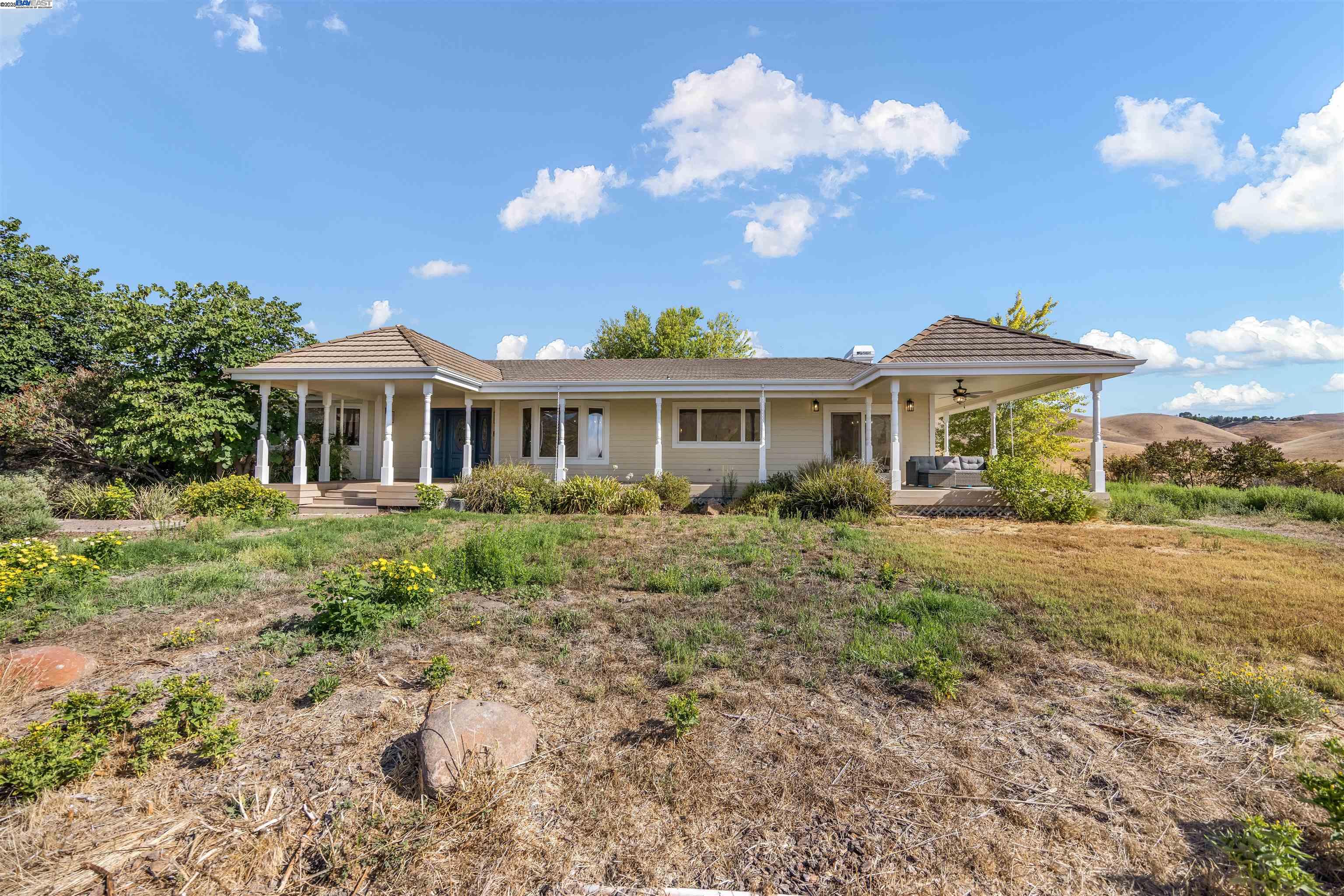 9050 Highland Road Livermore, CA 94551 - Photo 2 of 57 a view of a house with a yard