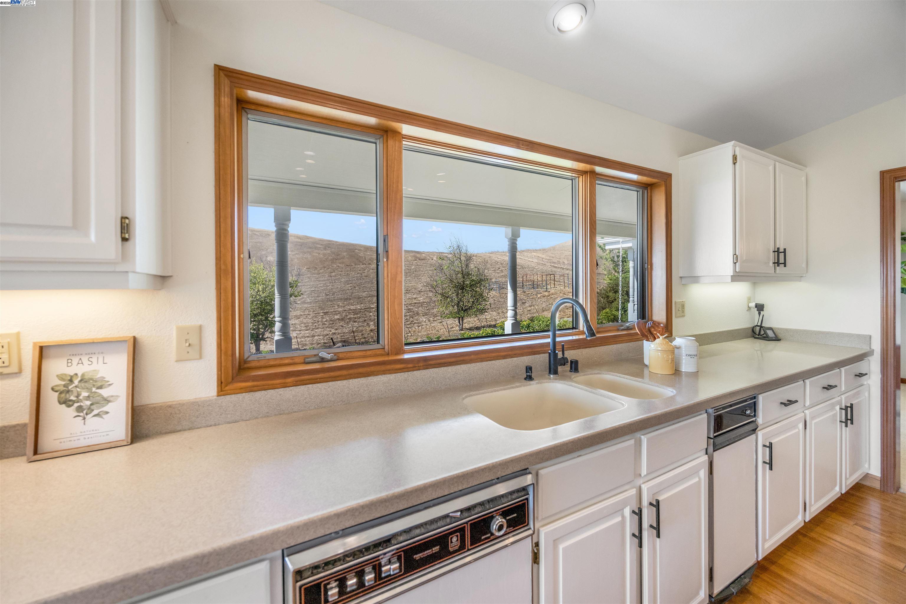 9050 Highland Road Livermore, CA 94551 - Photo 29 of 57 a kitchen with a sink and large window
