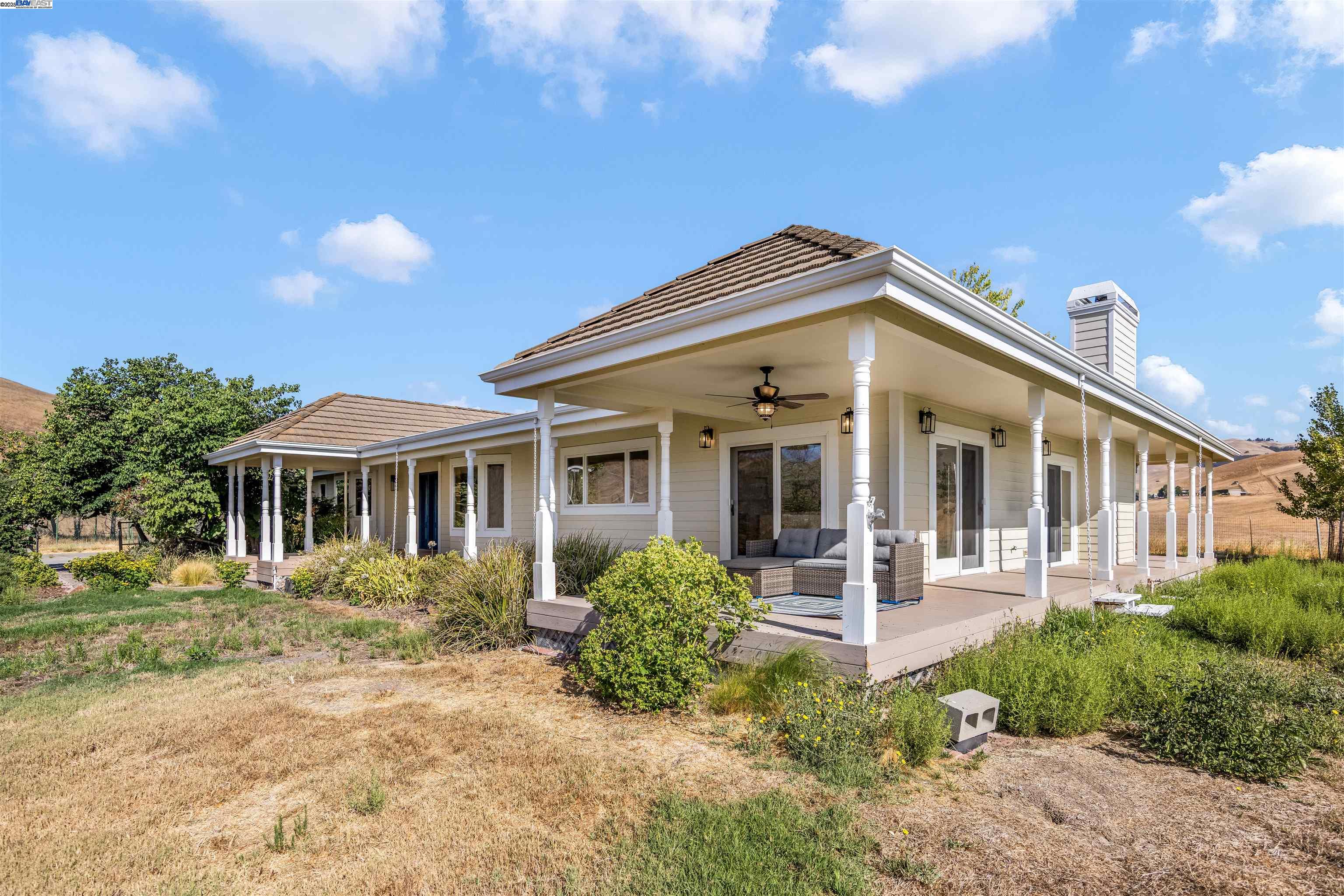 9050 Highland Road Livermore, CA 94551 - Photo 3 of 57 a front view of a house with a yard