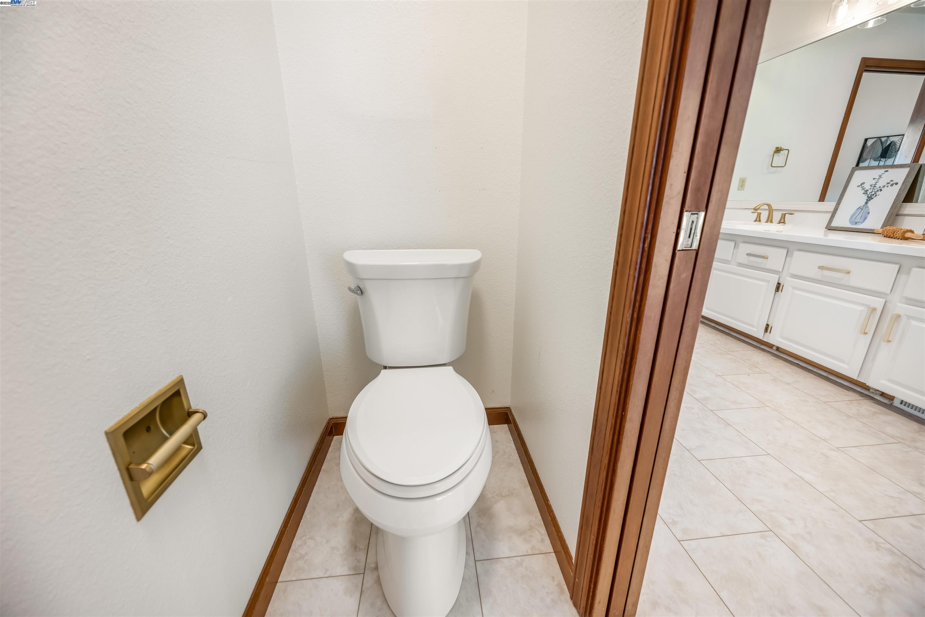 9050 Highland Road Livermore, CA 94551 - Photo 33 of 57 a white toilet sitting next to a sink