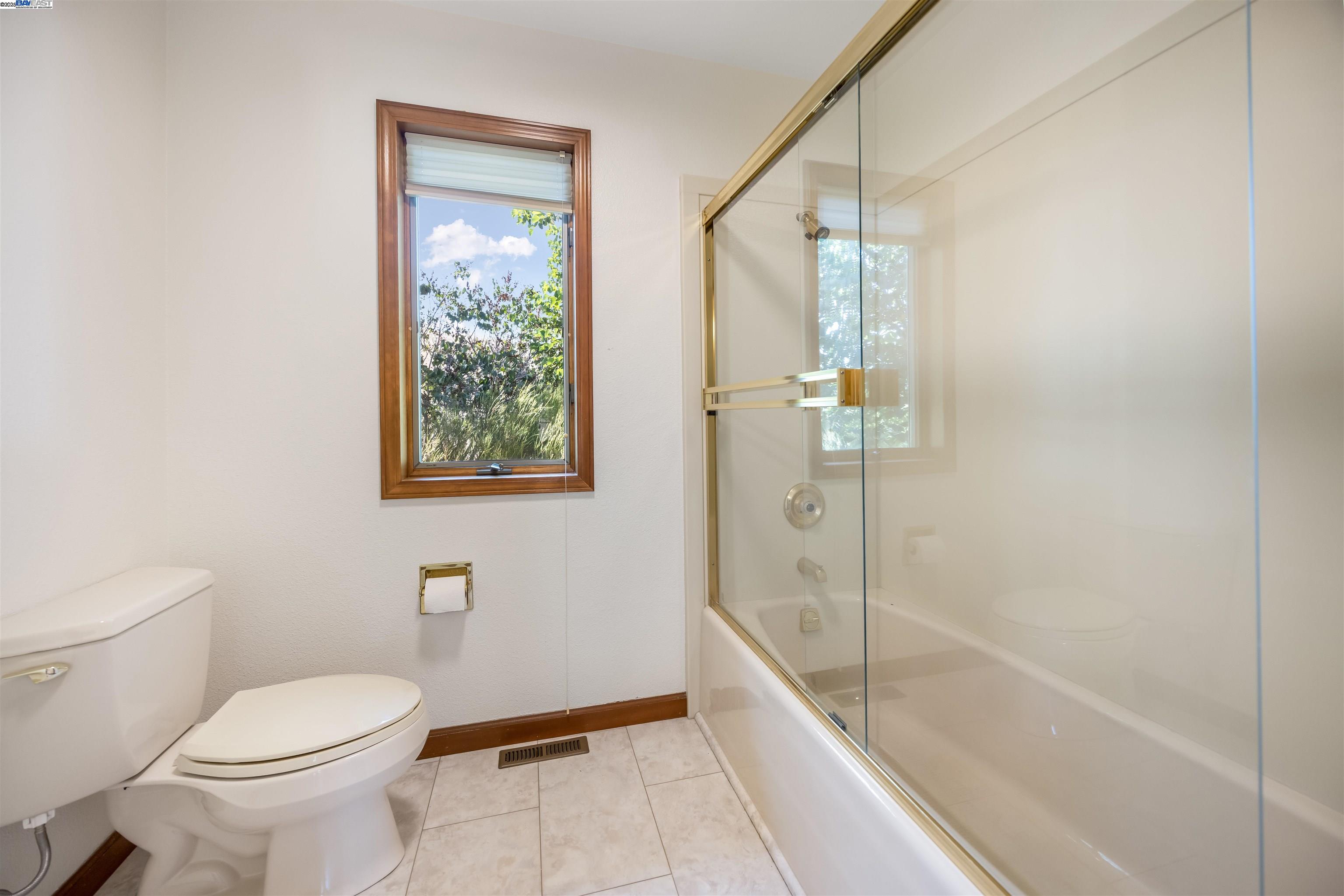 9050 Highland Road Livermore, CA 94551 - Photo 34 of 57 a bathroom with a toilet and a shower